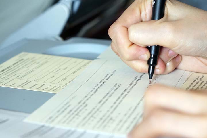 elderley couple filling out a form